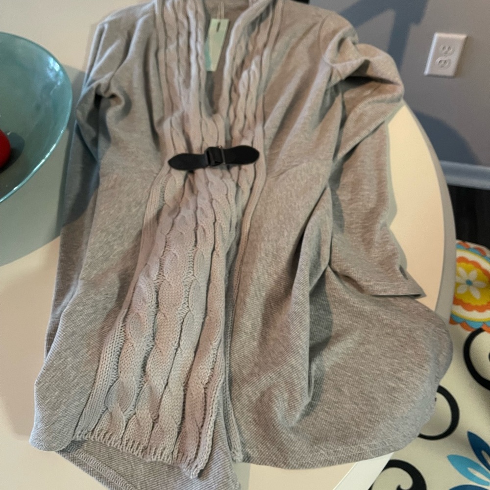 Sweater with cable trim and leather fastener
